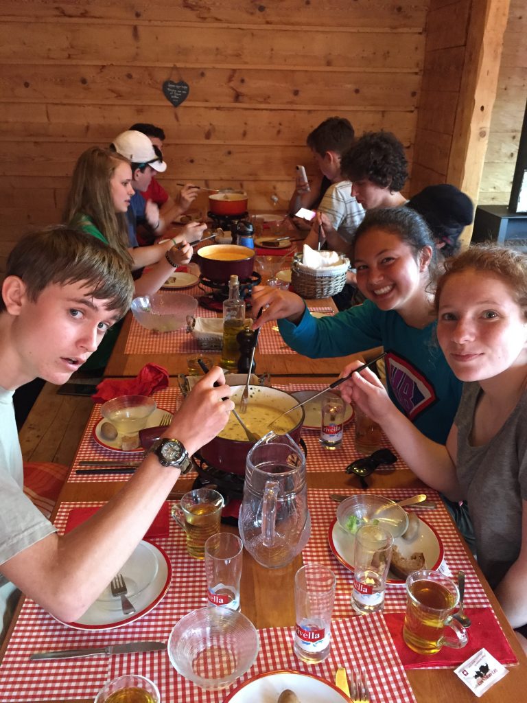 The gang loving traditional Swiss fondue at La Prafondaz, part un!