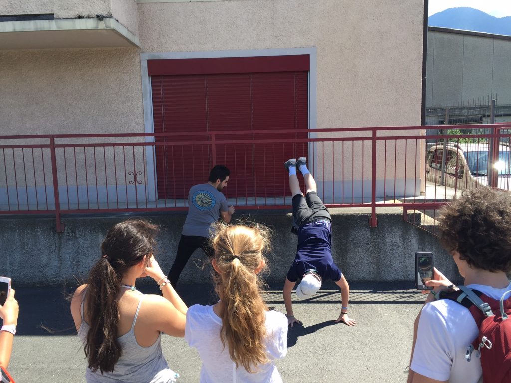 Ashton and Ollie teach us all some dance moves while we wait for our bus to Villeneuve.