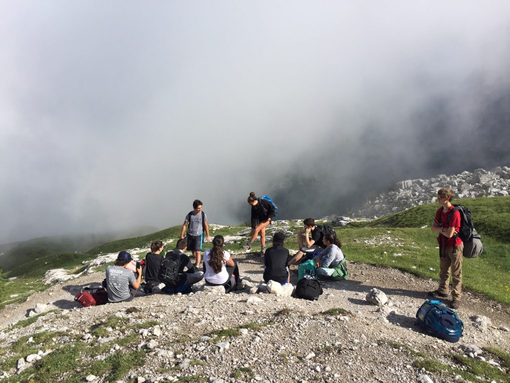 The team pauses for laughs and music on the morning hike back to Madonna di Campiglio as we make our way on to country 3: France! Paris, here we come.