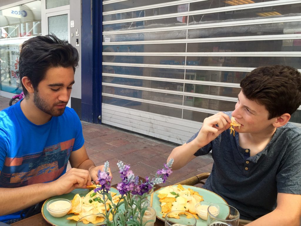 Ashton and Brendan engrossed in the coveted Dutch nachos. Nom nom!